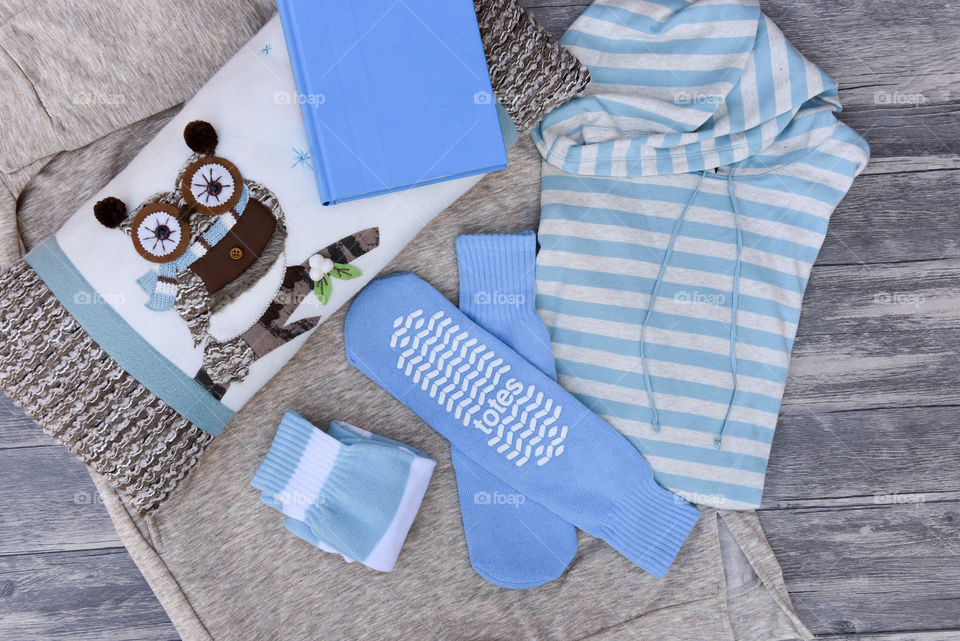 Flat lay of blue slipper socks and other blue items