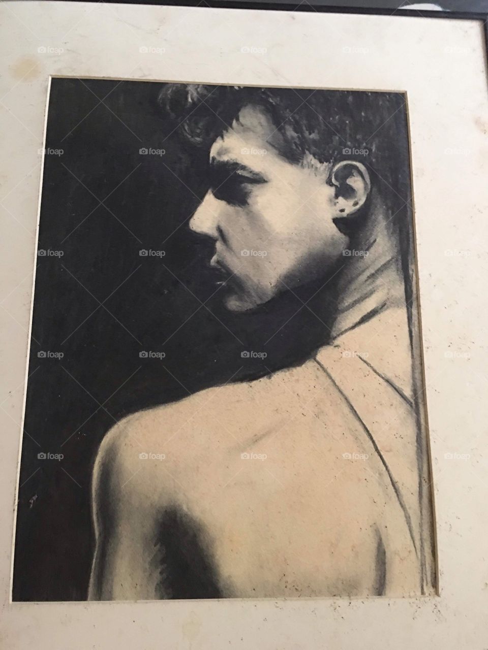 Original charcoal drawing of mine, young man looking over shoulder from bac