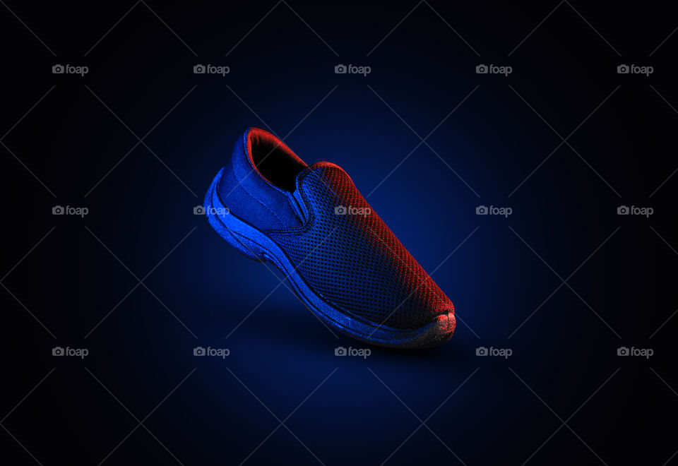Shoe with dramatic lighting in red and blue color