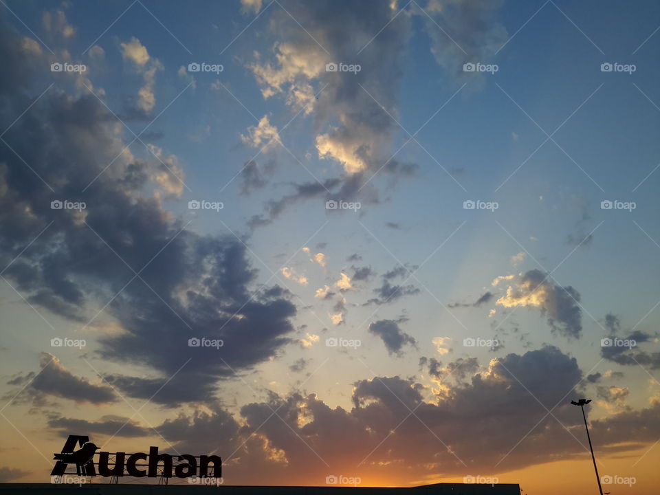 Sunset over hypermarket Auchan