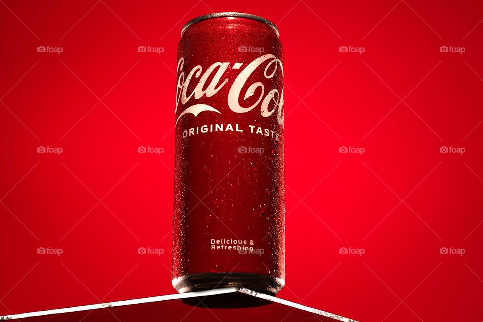 Coca cola can on a glass
