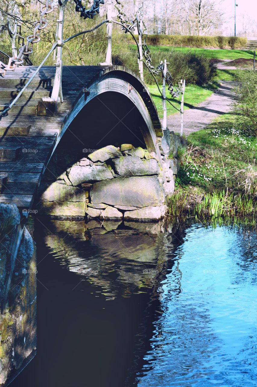 Arch bridge over the lake