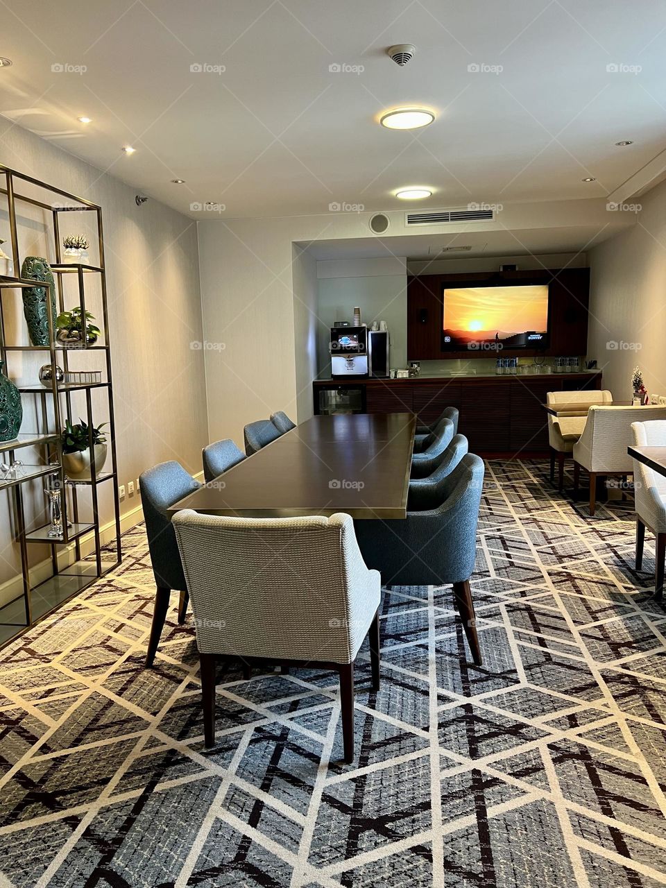 Long dining table with soft chairs