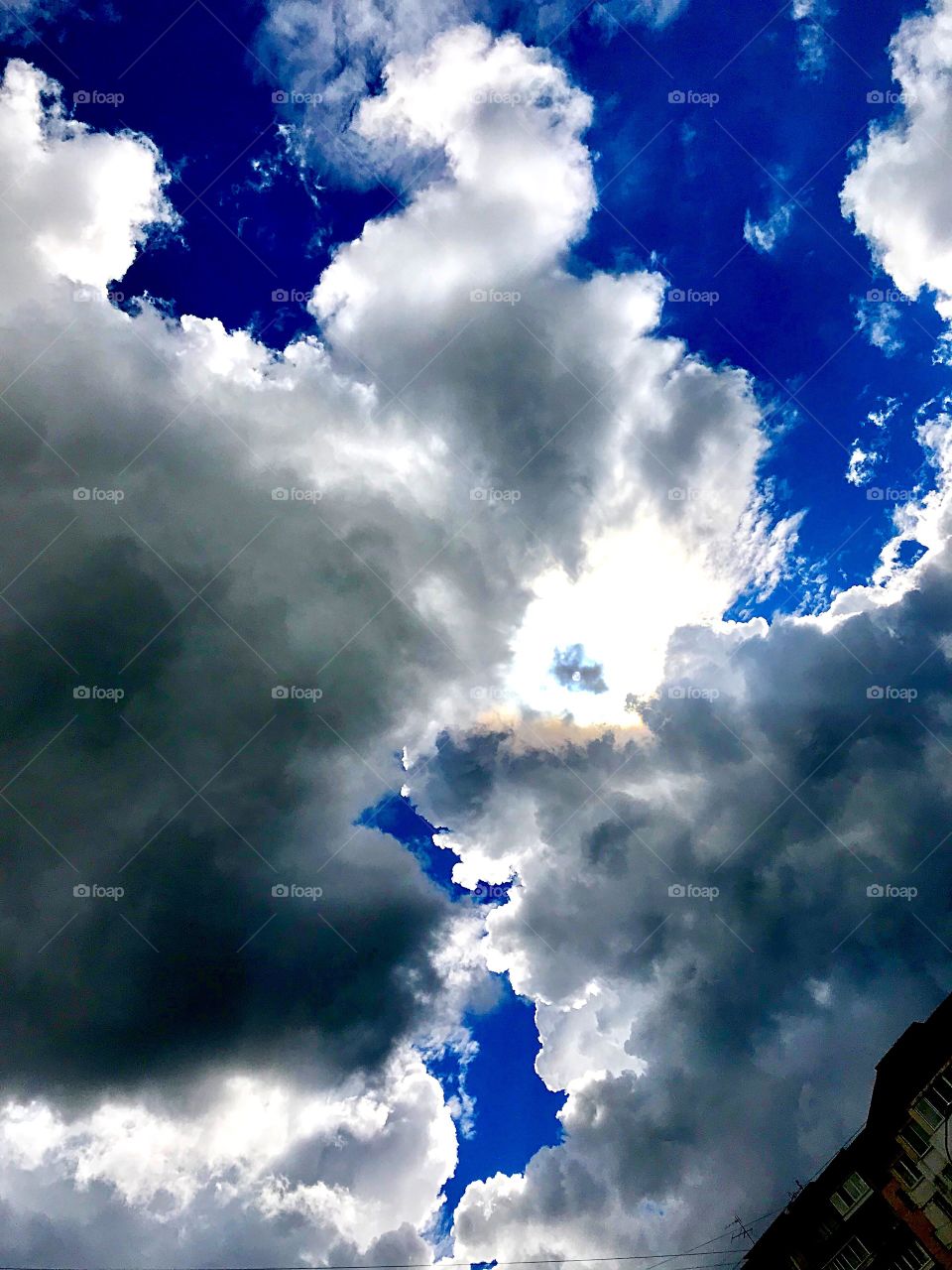 Rain clouds covering the blue sky