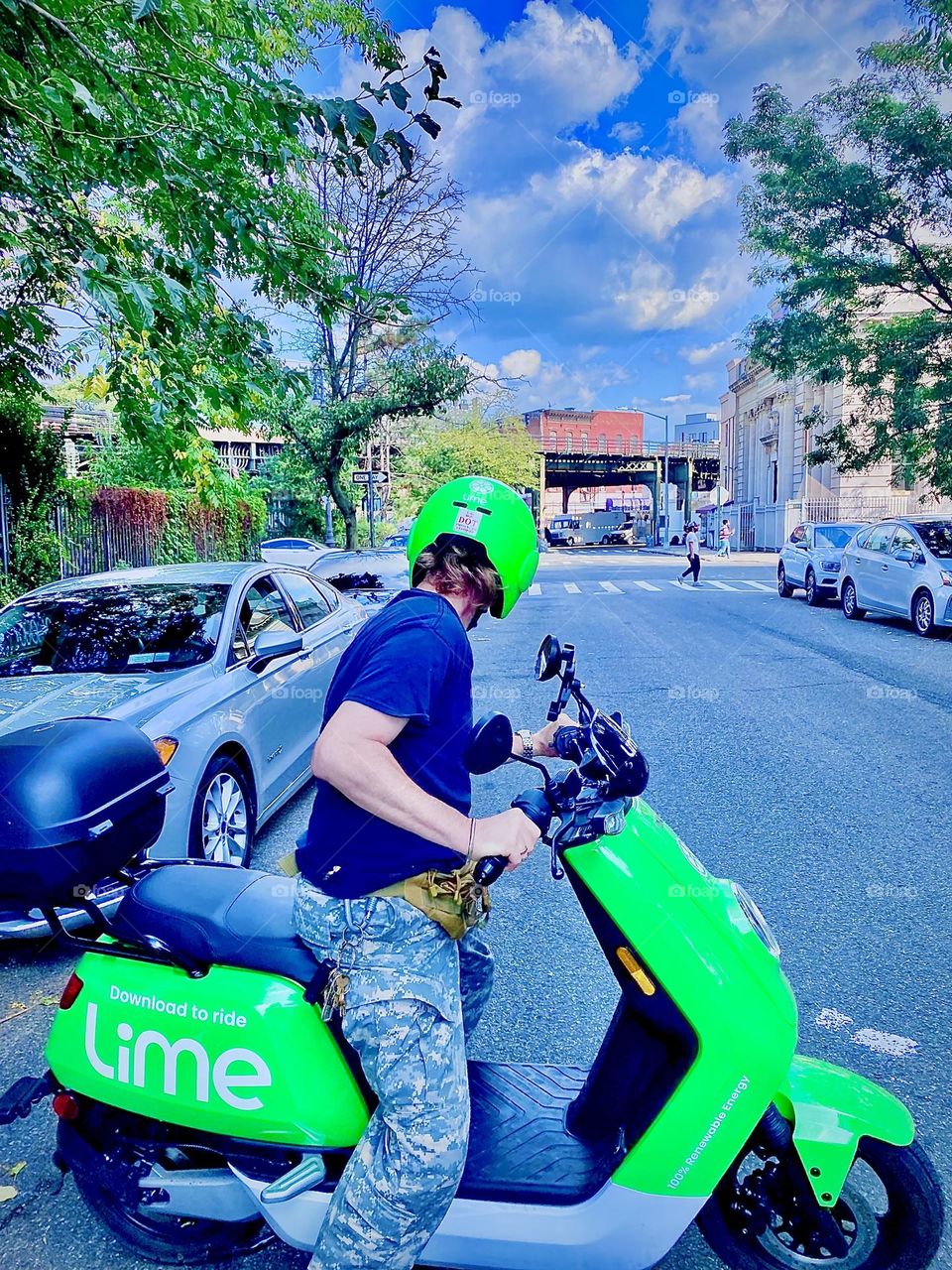 LIME electro scooter rider Timothy Trespas has just turned his vehicle around to head back to LIC, Queens, NY from Bushwick, Bklyn near the “Myrtle Ave & Broadway” M train station. August 2021. Hypnotic Productions