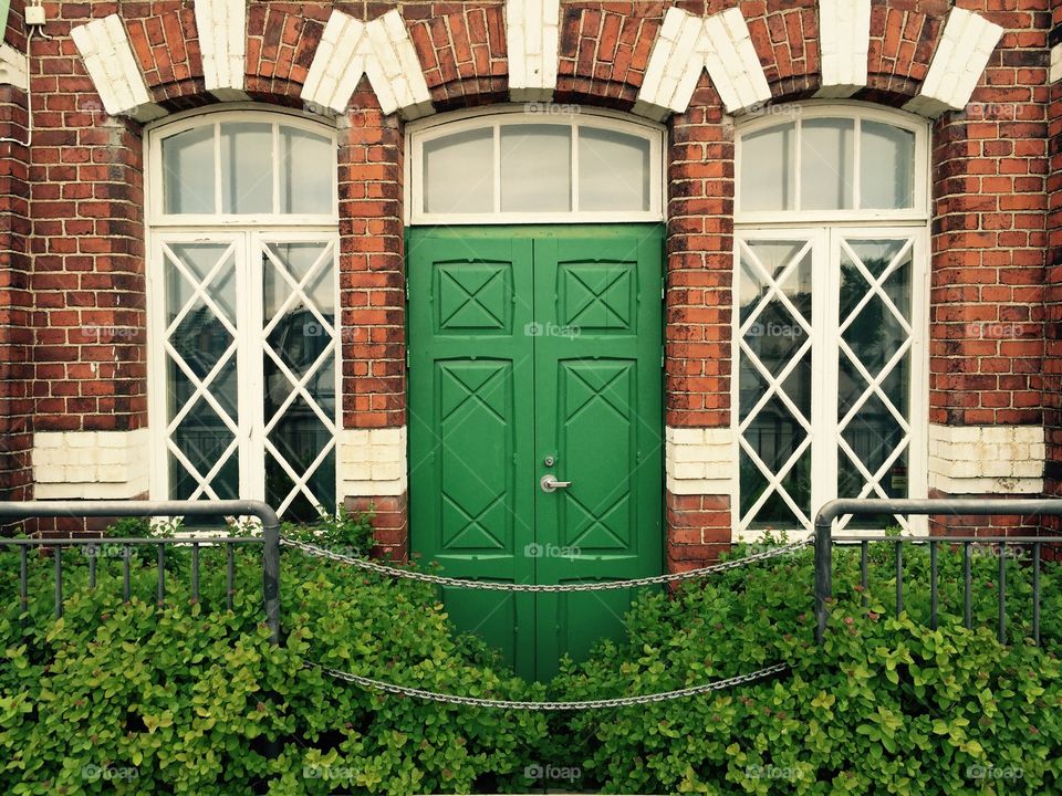 No entry. Green door to the red brick building