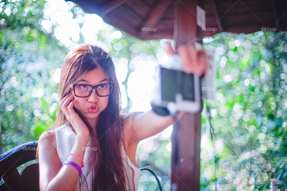 Funny girl taking selfie 