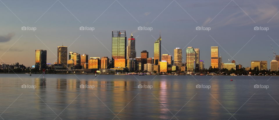 sun setting on perth city