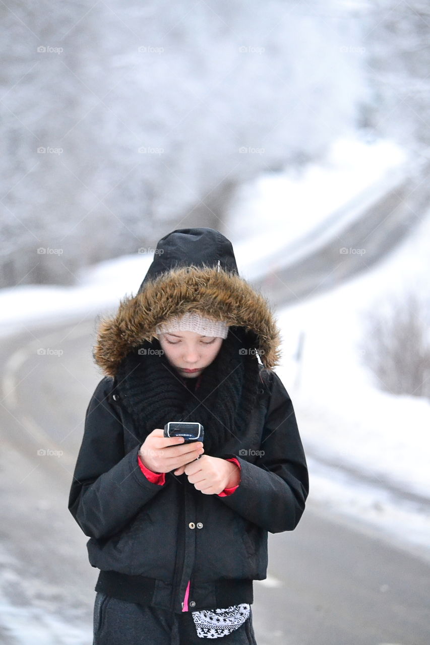 Portrait of girl holding cellphone