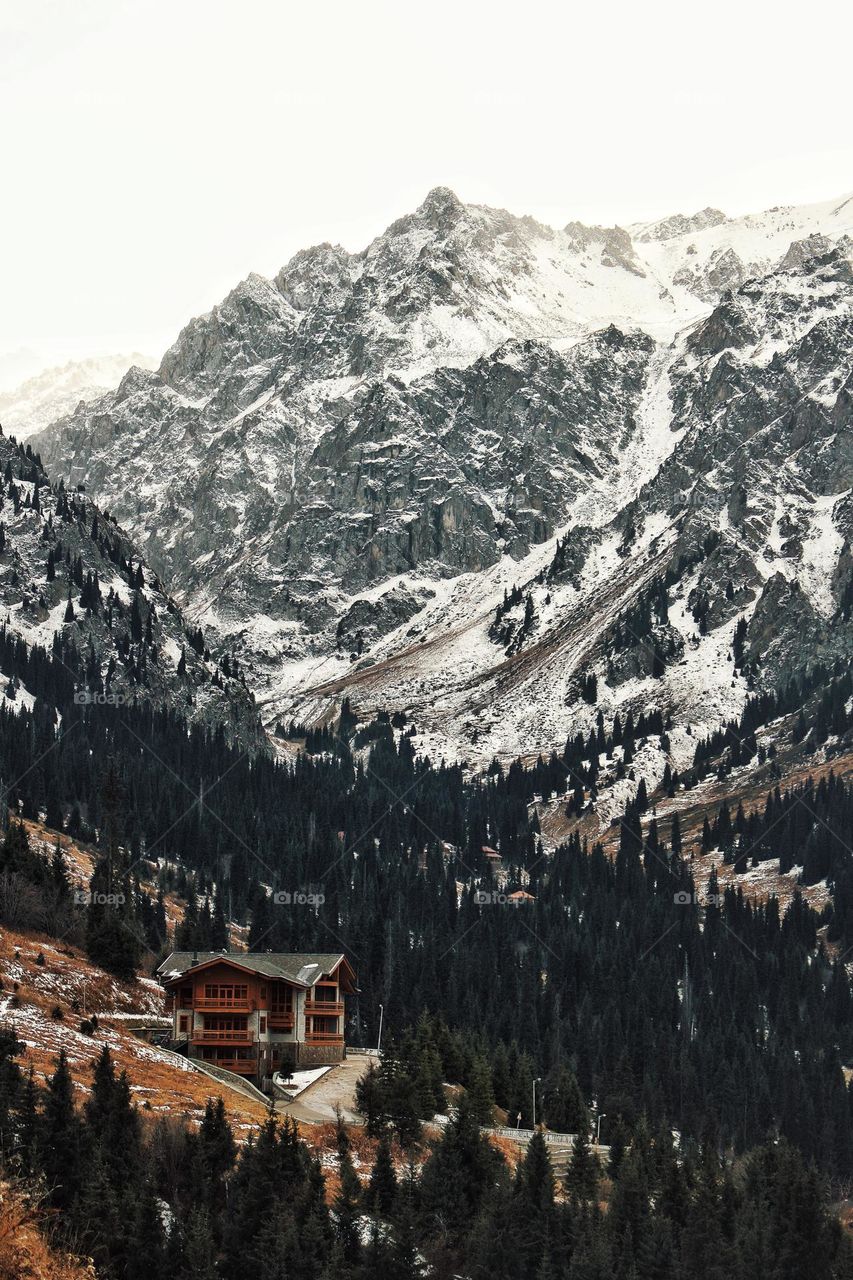 Mountain landscape with a small house