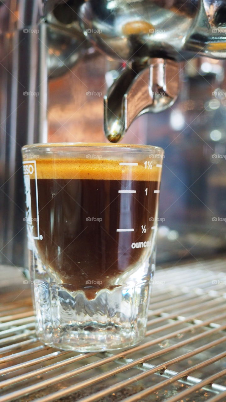 Barista espresso coffee shot. Glass of espresso coffee barista shop