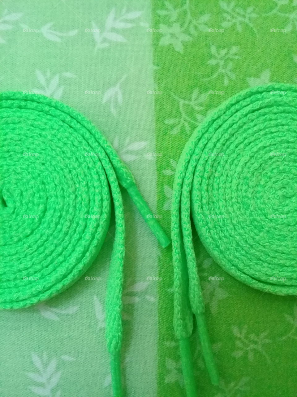 Shoe laces on its rolled design.