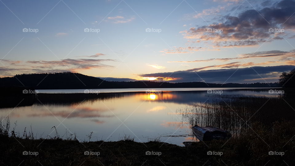 Beautiful Swedish landscape in late autumn, sunset over mirror lake - vacker solnedgång över spegelblank sjö sen höst , natur landskap Sverige