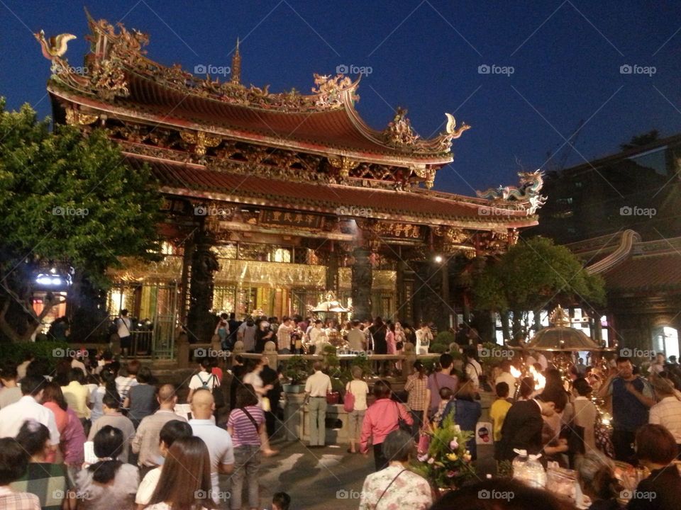 Devout believers at Wanhua Longshan Temple pay homage