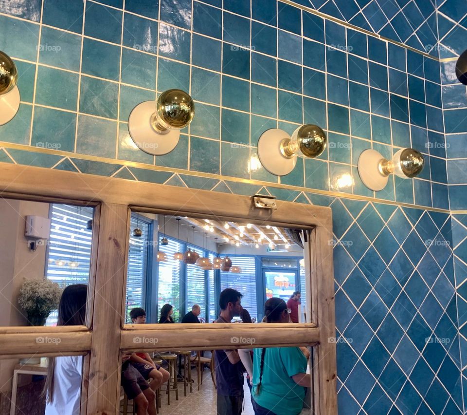 Reflection in the mirror inside coffee shop