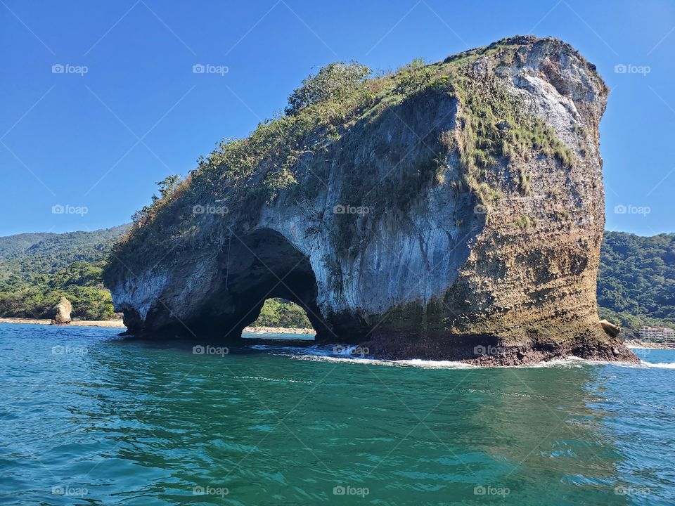 Natural cave right through a small island.