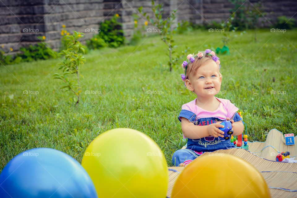 Smiling girl sitting on mat