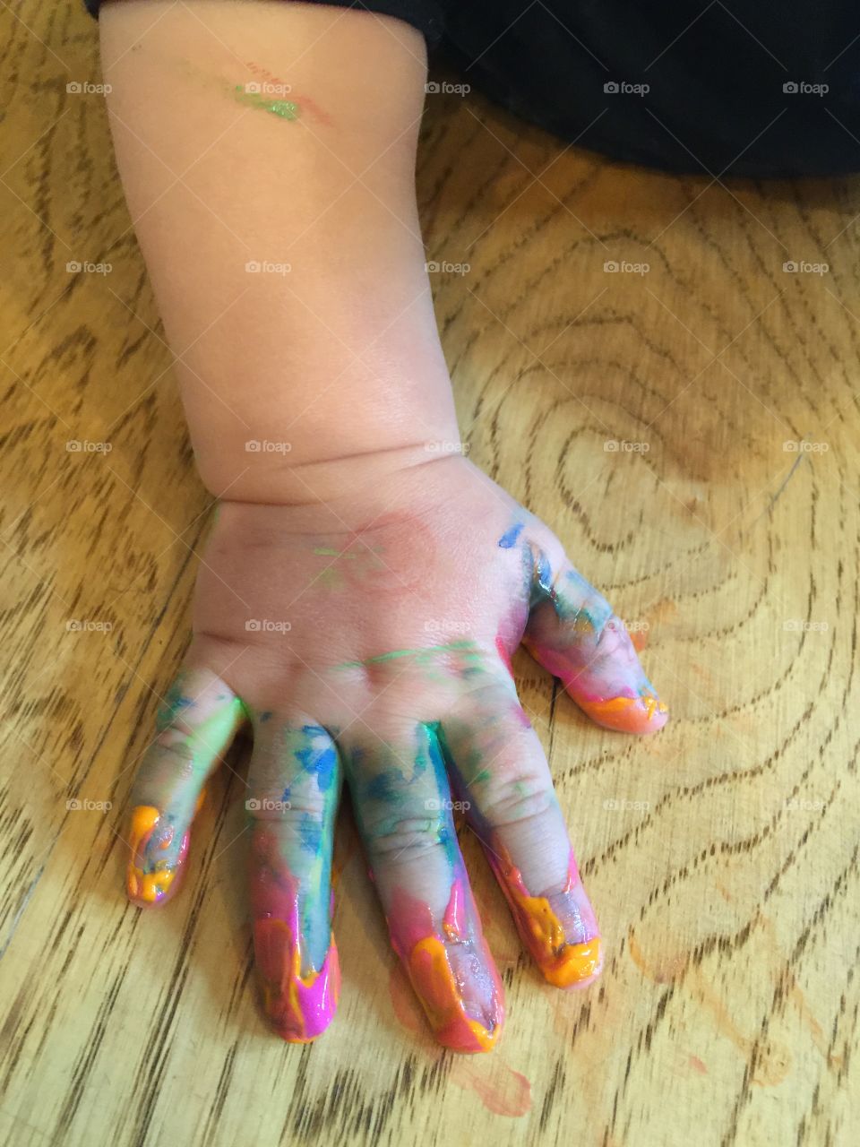 Painted baby's hand
