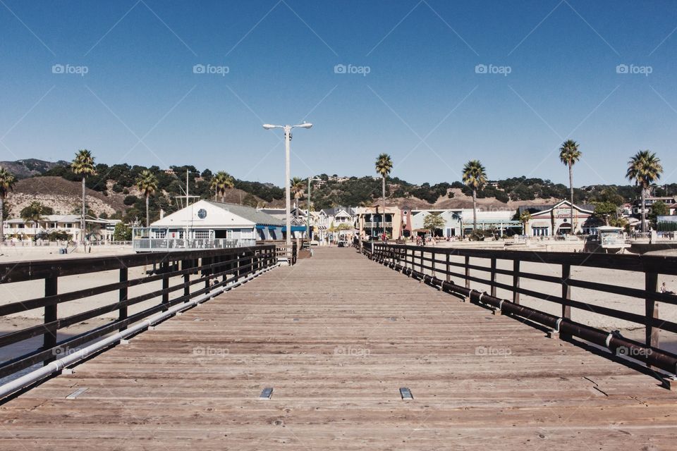 View of a small beach town from a pier 