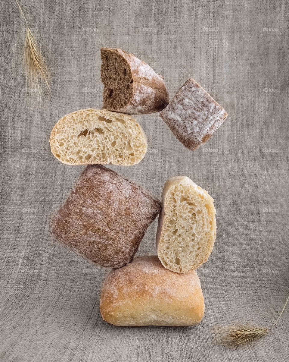 Pieces of bread on nature cloth, balance and levitation 