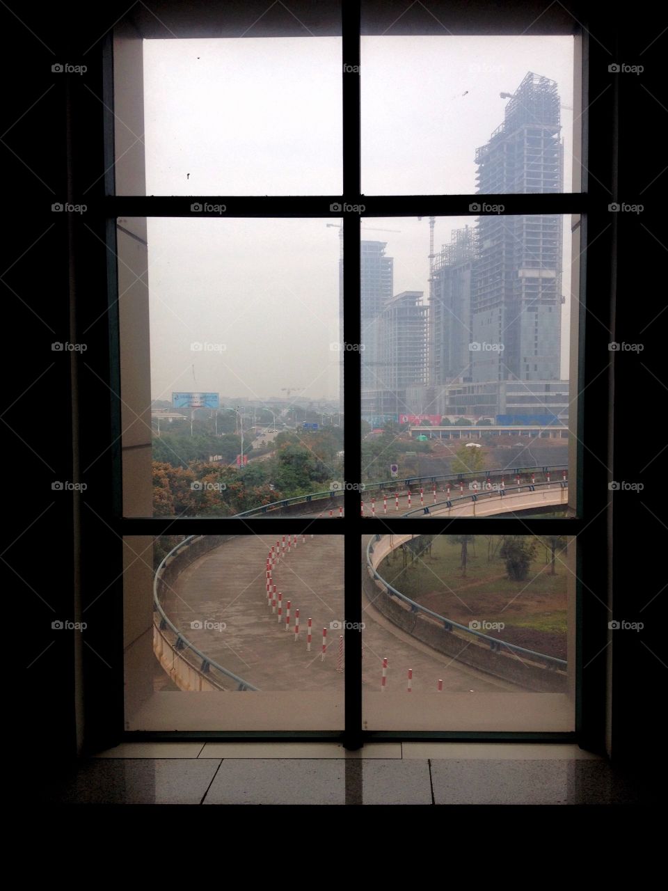 Cityscape from the window on a building and a ramp