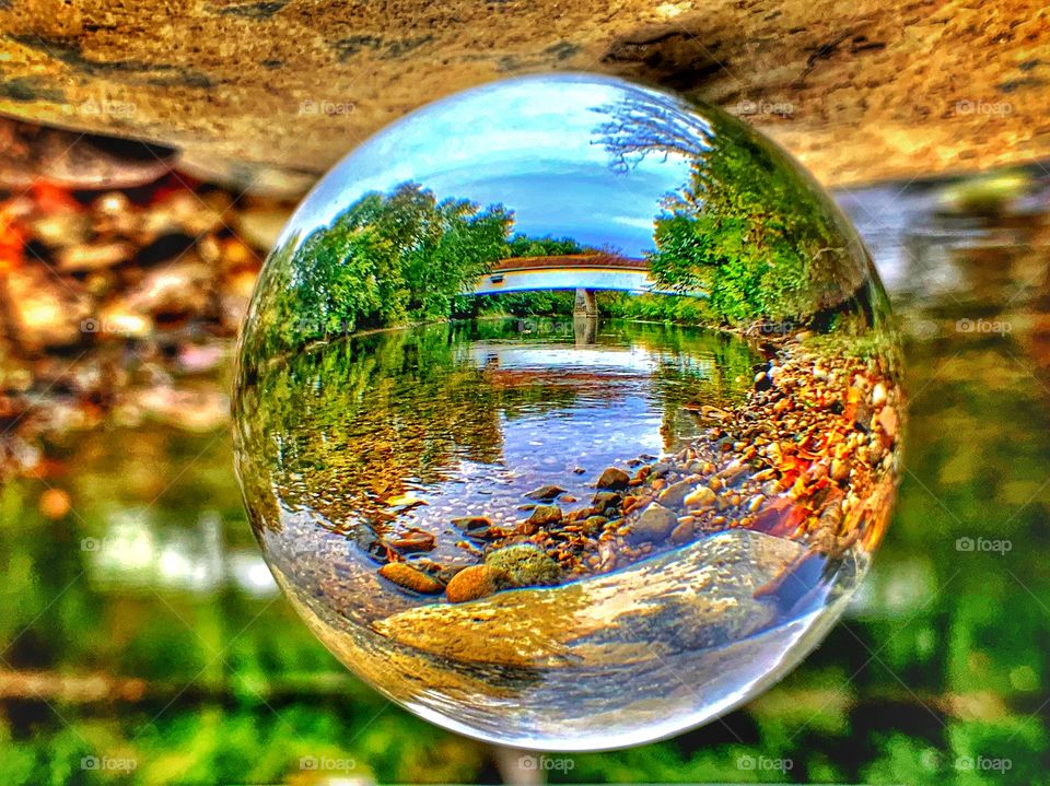 Beautiful covered bridge views in Indiana on a fall day through a crystal ball. 