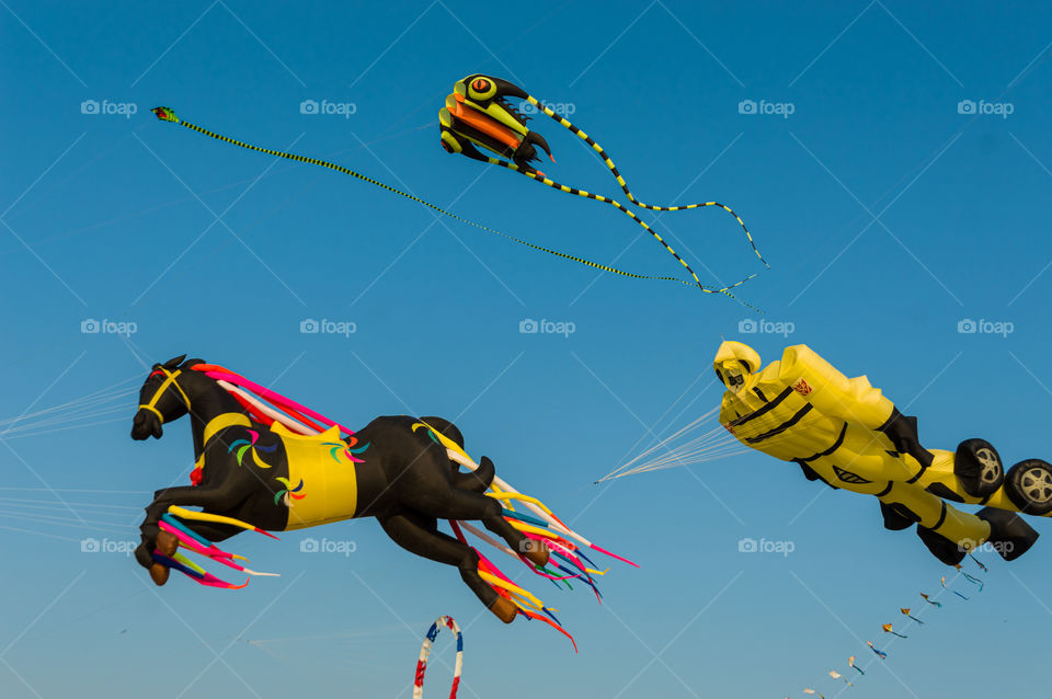 Colorful kites flying in the sky.