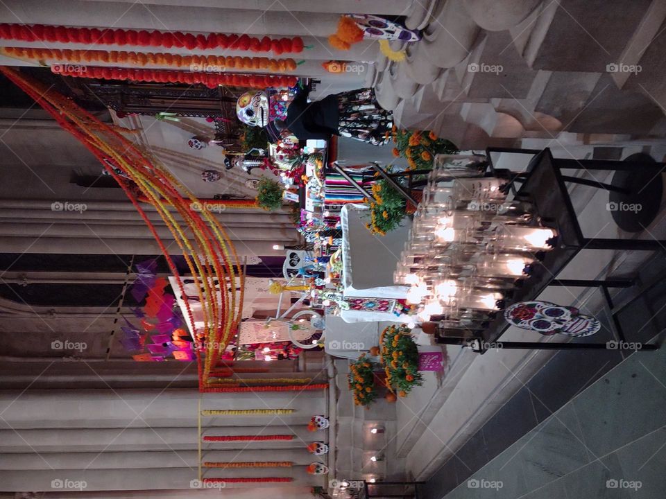 garlands of marigolds adorn an ofrenda during Day of the Dead observances at Cathedral of St John the Divine