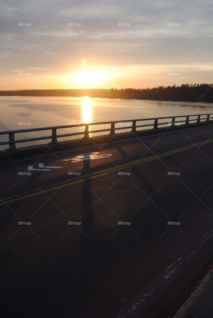 Yarmouth,ME Snodgrass bridge.

"sunset casting shadows across the bridge."
warmer temperatures are coming an soon we'll all be out and about feeling sun's rays flashing upon us.

spring is here, an very near.