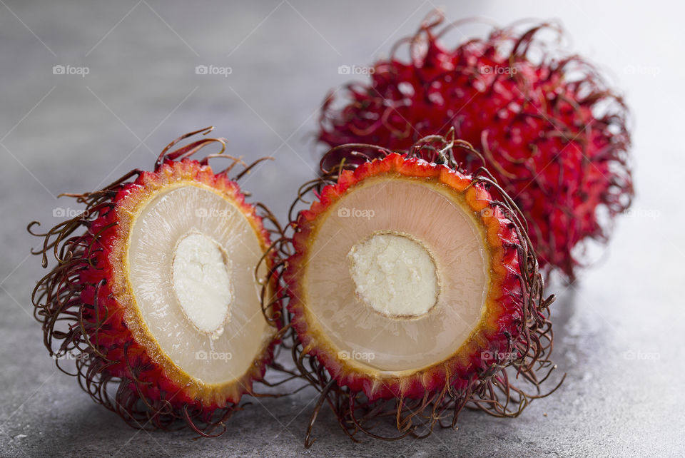 close up rambutan fruit halved