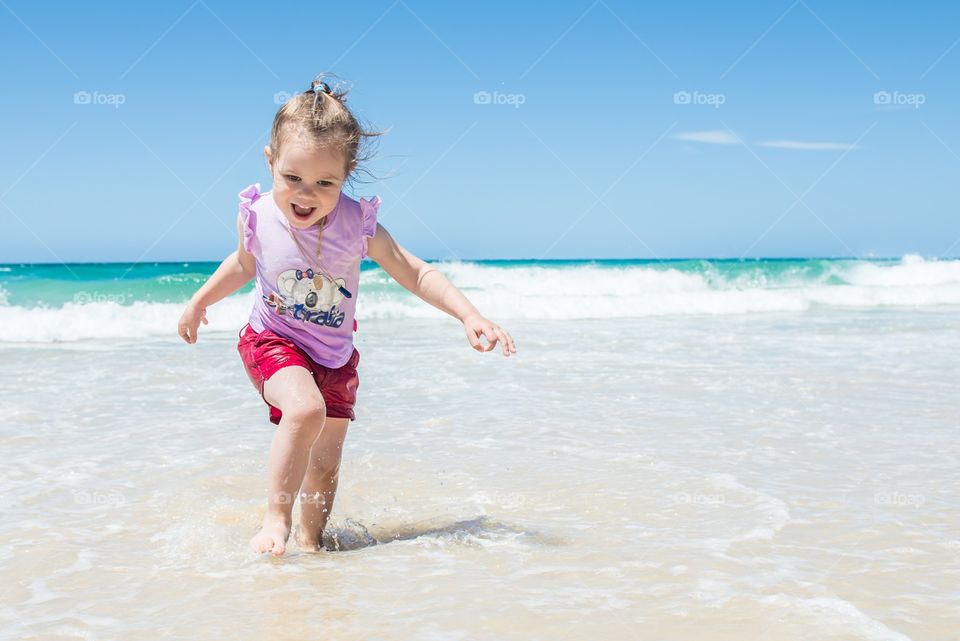 Girl running in sea