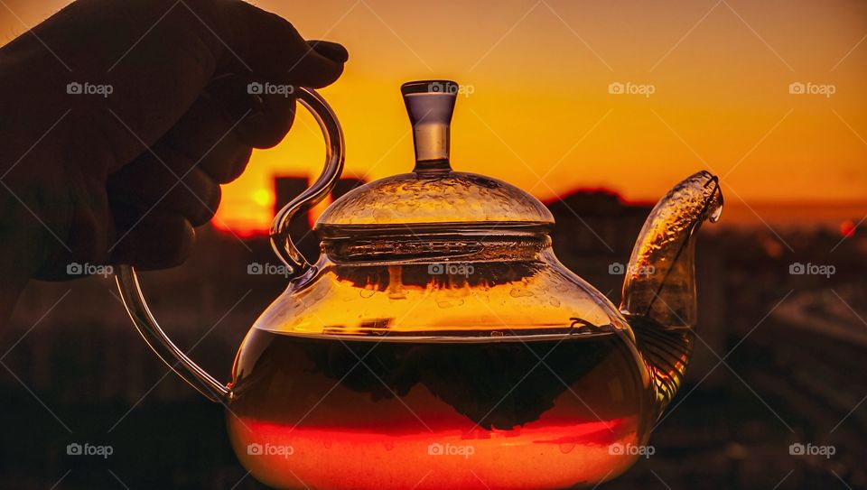 the reflection of the sun in the teapot
