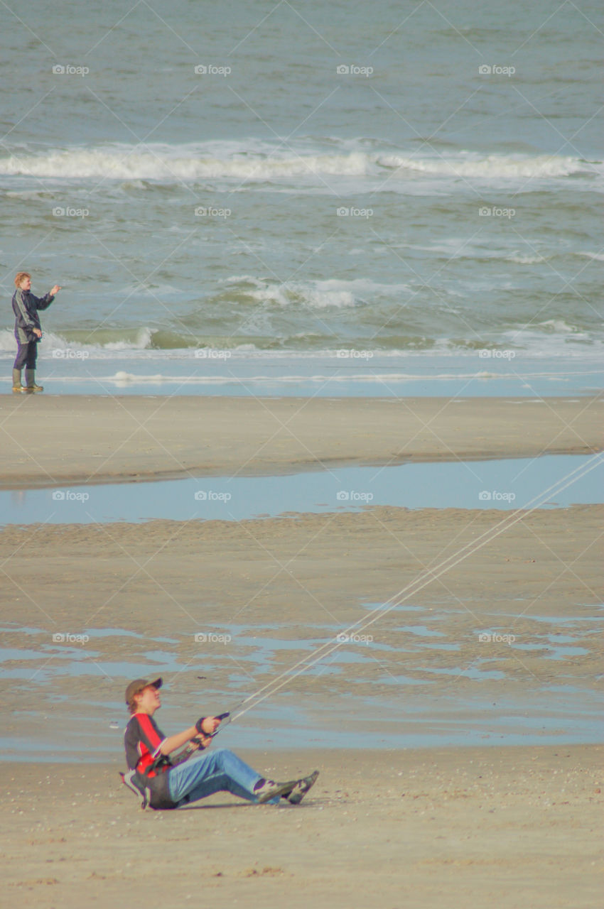 Playing With A Kite At The Beach