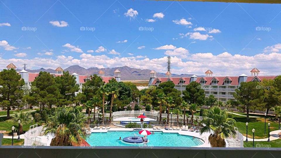 Desert Resort swimming pool. Beautiful day at the resort in the desert