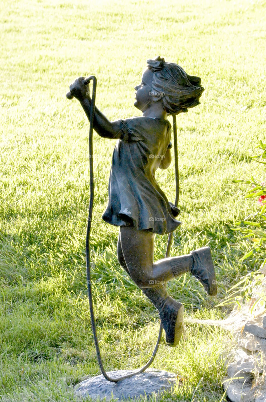 Bronze beautiful statue only seen down an unmarked one way path along am irrigation ditch in Colorado.