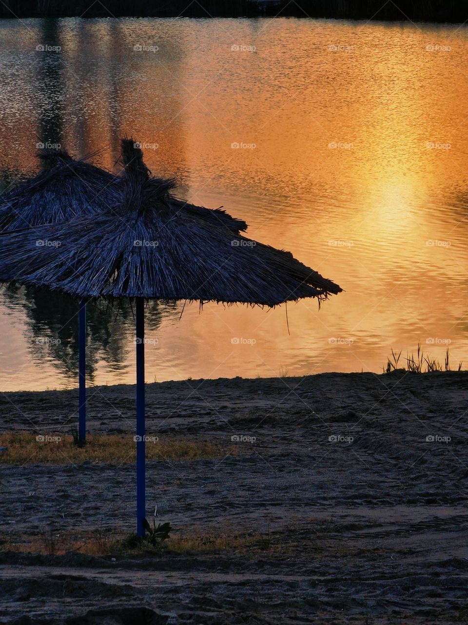 the reflection of the sunset in the water