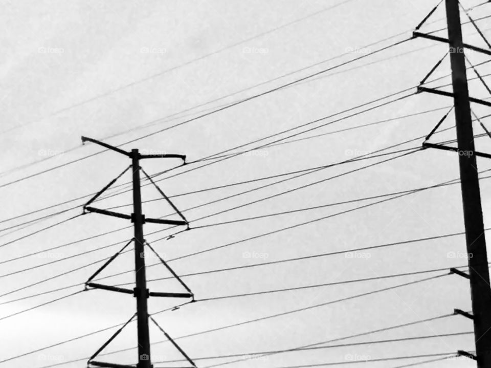 Iron giants and power lines in black and white 