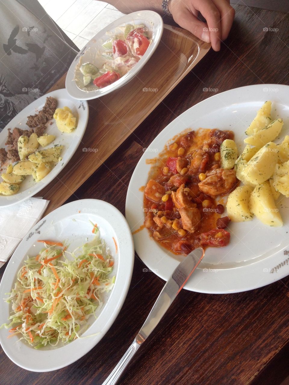 Dinnertime with salad and potato with fried vegetables 