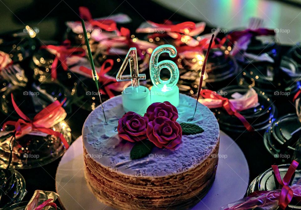 Birthday cake on black end pink background