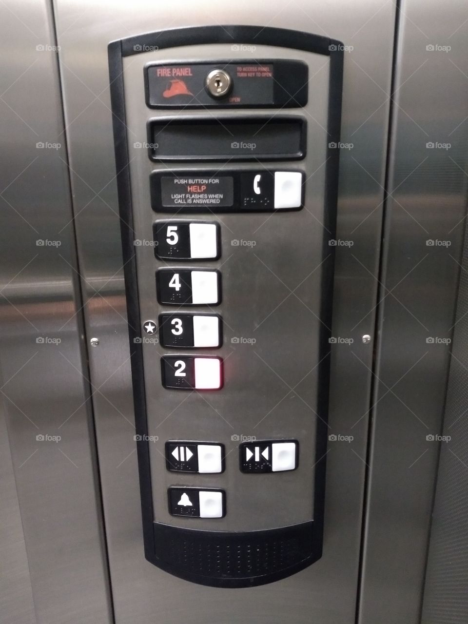 elevator control panel. 2nd through 5th floor.