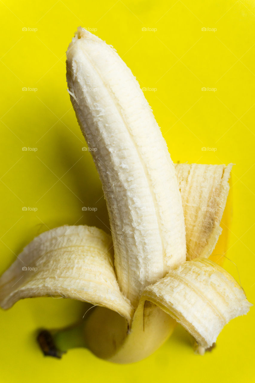 yellow banana on a yellow background