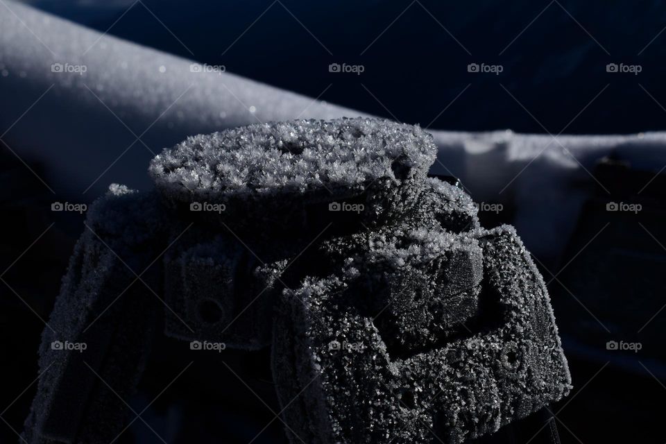 tripod with snow bushes due to cold weather