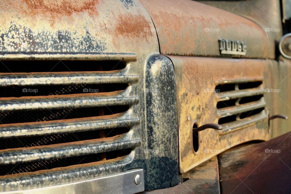 Side view of an antique truck's engine vents