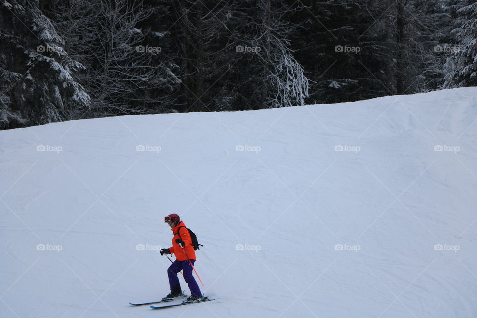 Man skiing on a lower mountain side 