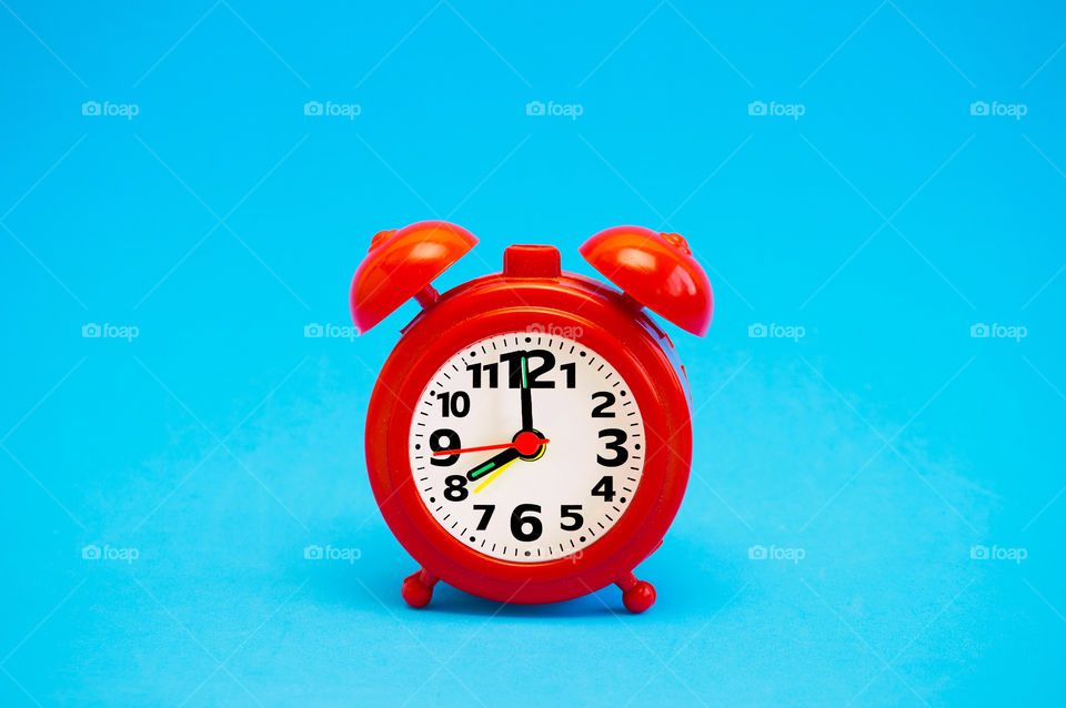 Clock isolated on blue background 