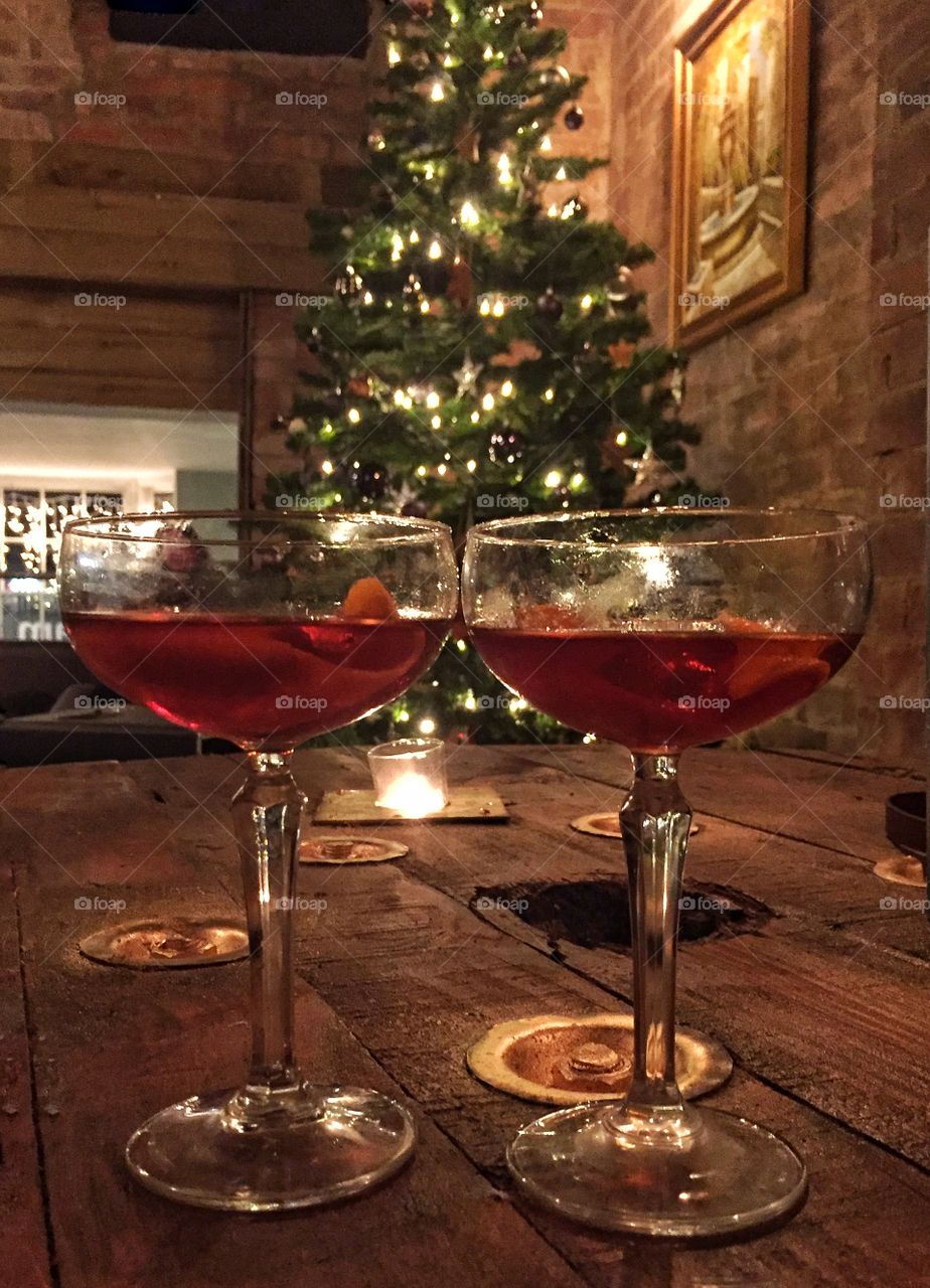 Christmas cocktails on wooden table