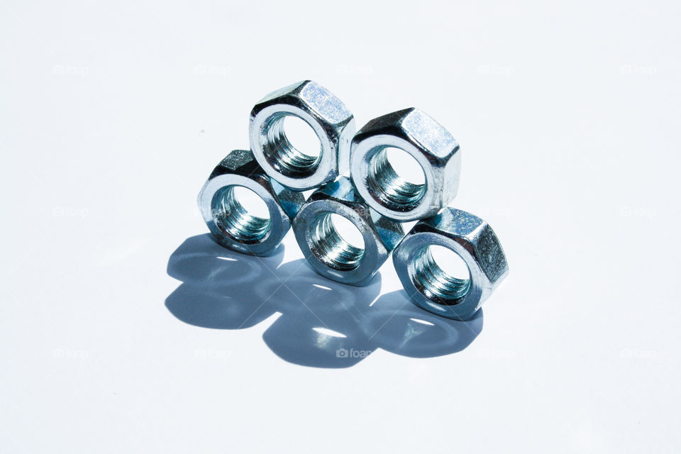 steel nuts on a white background