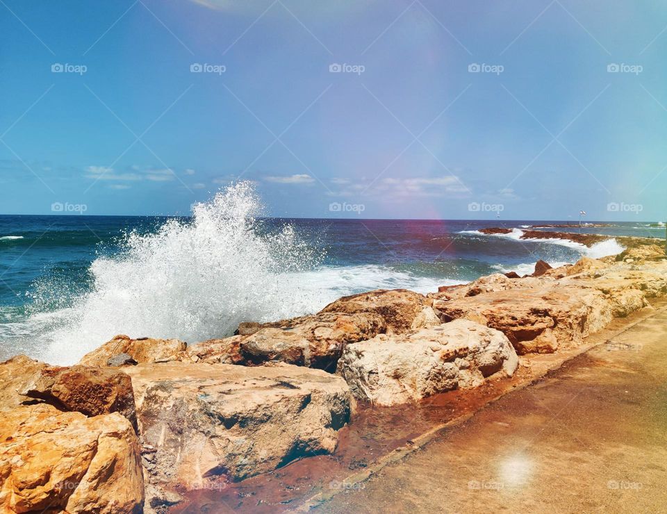 Splashing wave on rocks