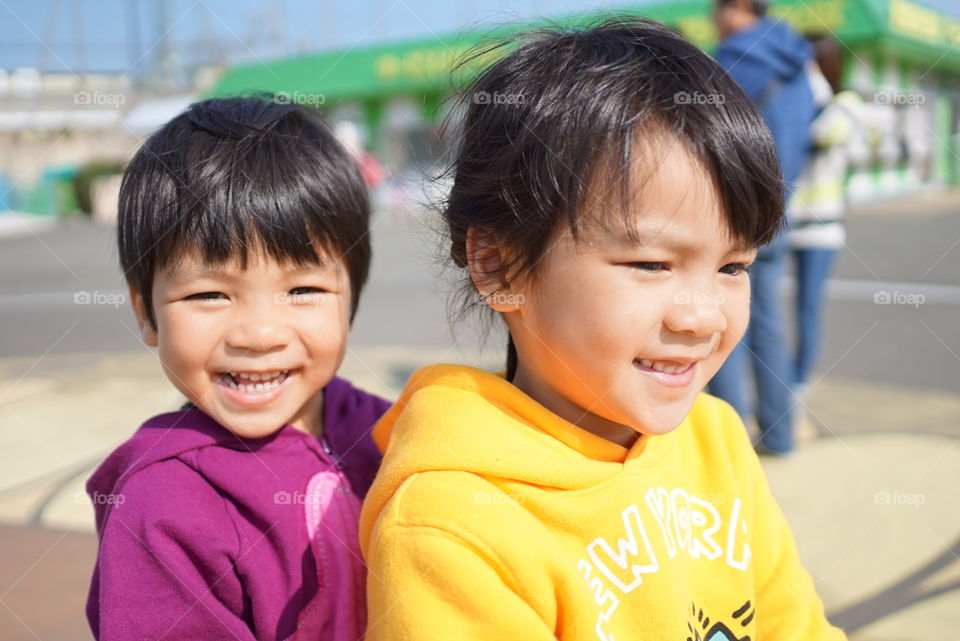 Happy Japanese children in playground 