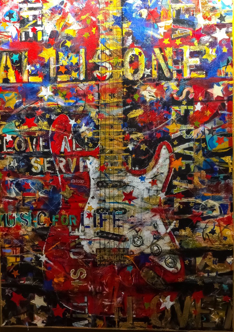 Vibrant and loud rock and roll collage art in local casino.